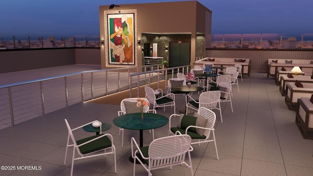 view of patio terrace at dusk