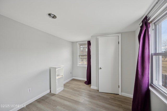 empty room with light wood-type flooring