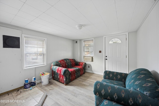 living room featuring cooling unit and light wood-type flooring