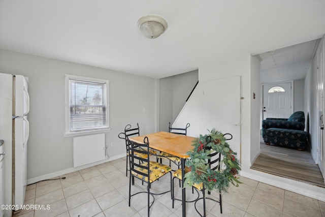 dining room with light tile patterned flooring