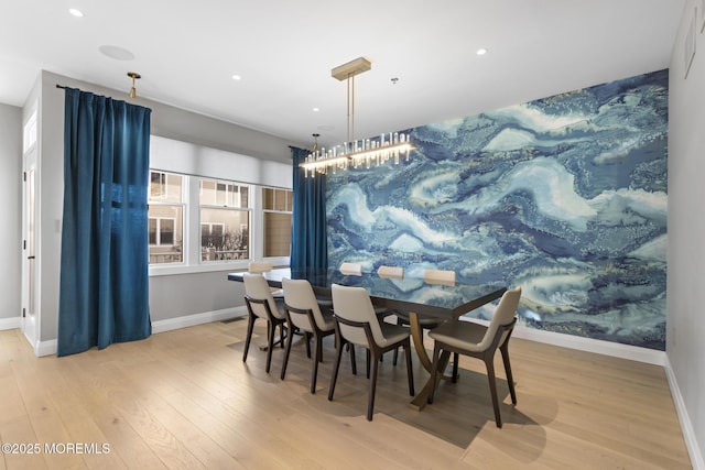 dining space with light hardwood / wood-style flooring