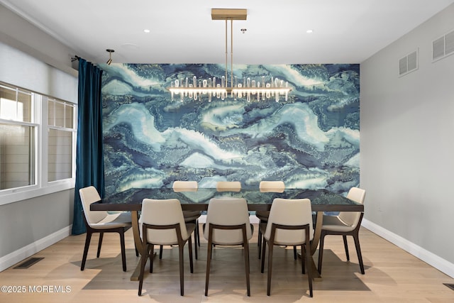 dining space featuring light wood-type flooring