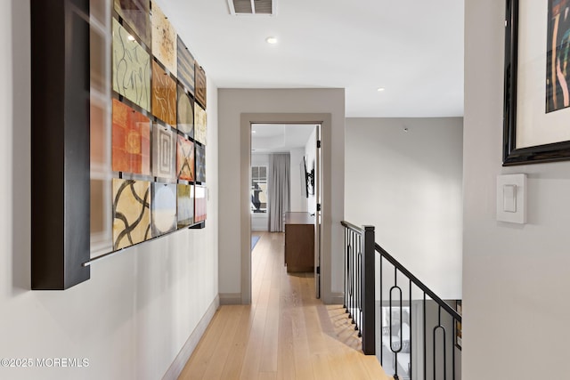 hall with light hardwood / wood-style flooring