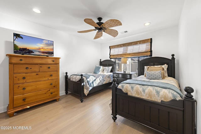 bedroom featuring ceiling fan and light hardwood / wood-style floors