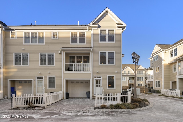 townhome / multi-family property featuring a garage