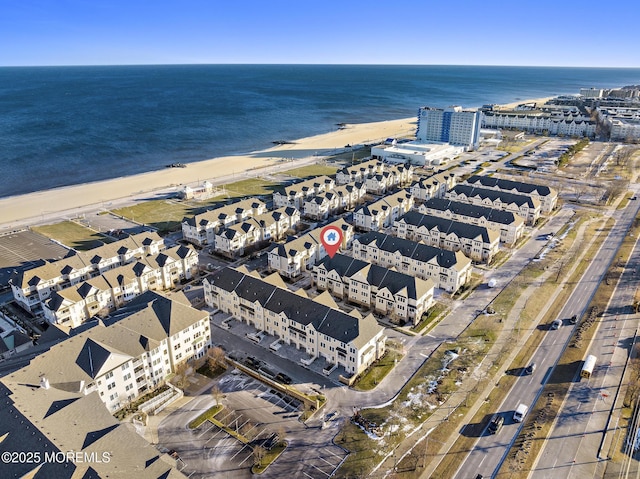 aerial view with a view of the beach and a water view