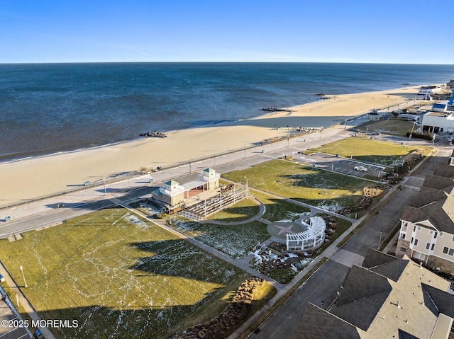 birds eye view of property featuring a water view and a view of the beach