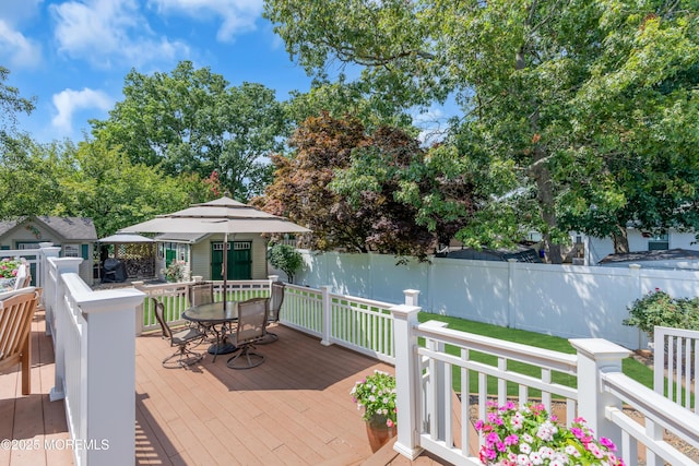 wooden terrace with an outdoor structure