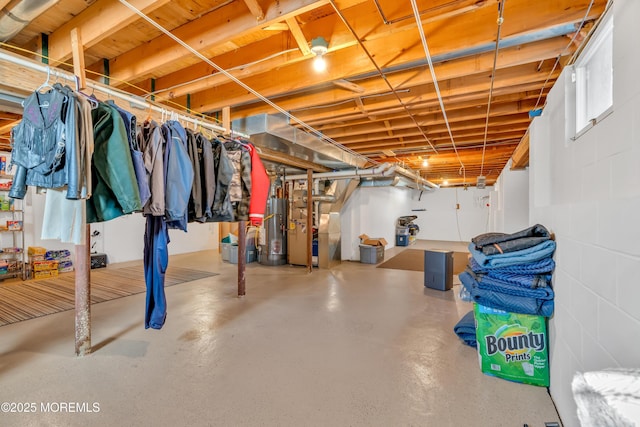 basement featuring heating unit and gas water heater