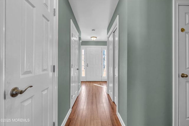 hallway featuring light wood-type flooring