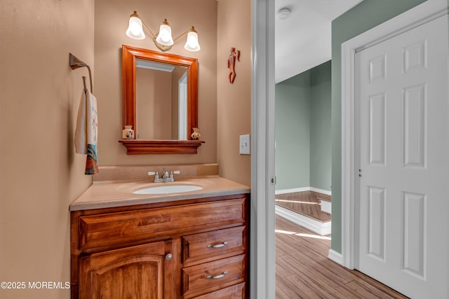 bathroom with vanity and hardwood / wood-style floors