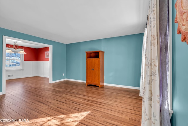 unfurnished room featuring light hardwood / wood-style flooring