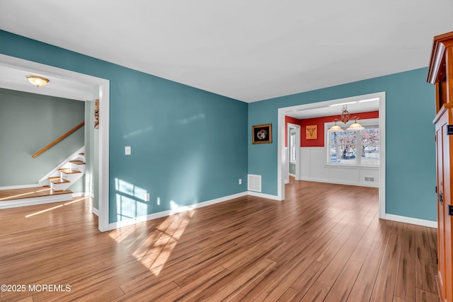 unfurnished living room featuring wood-type flooring