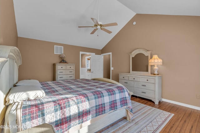 bedroom with ceiling fan, high vaulted ceiling, and light hardwood / wood-style floors