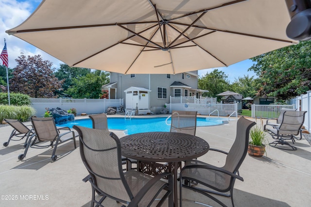 view of swimming pool featuring a patio area