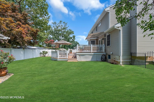 view of yard featuring a wooden deck