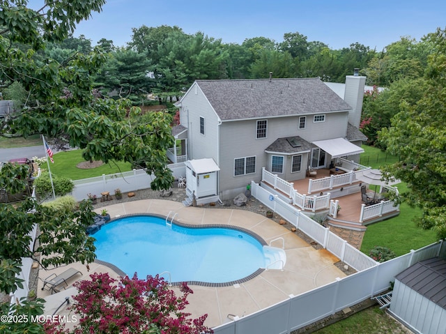 view of swimming pool featuring a deck