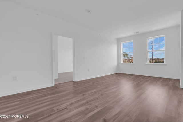 unfurnished room featuring wood-type flooring