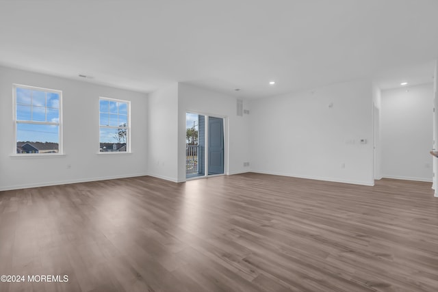 spare room with light hardwood / wood-style floors