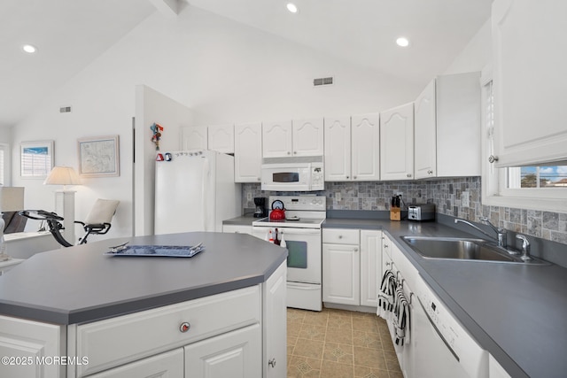 kitchen with sink, white cabinets, white appliances, and decorative backsplash