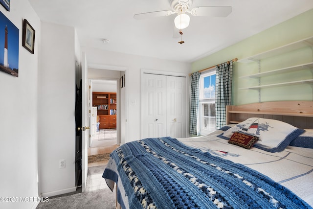 bedroom featuring carpet flooring, ceiling fan, and a closet