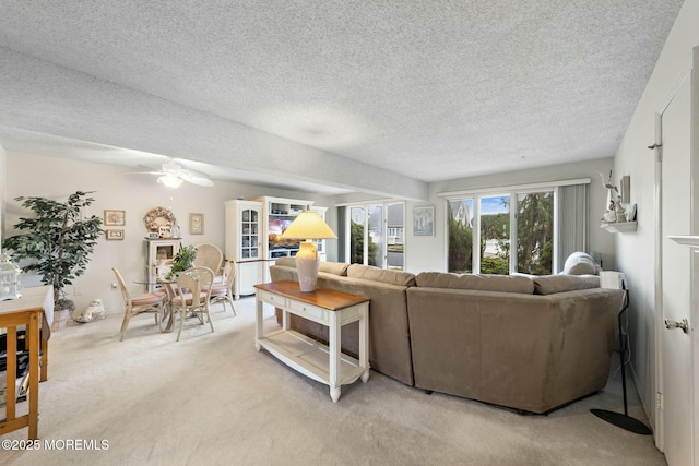 living room with light carpet and a textured ceiling