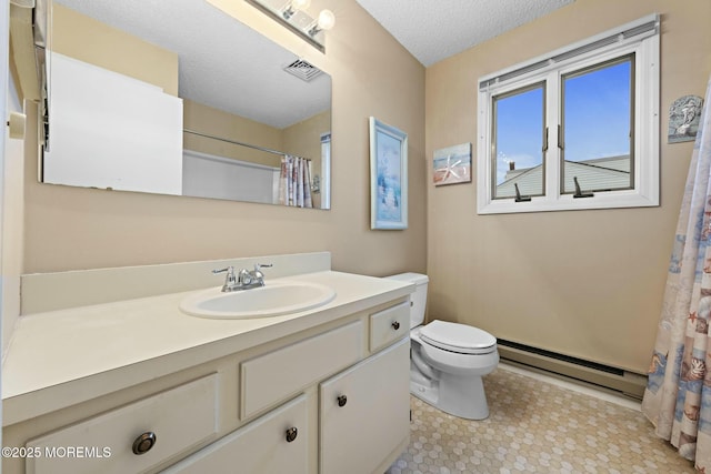 bathroom with a baseboard radiator, vanity, a textured ceiling, and toilet