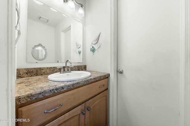 bathroom with vanity and a textured ceiling