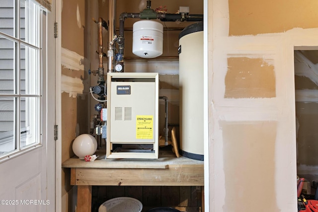 utility room featuring water heater