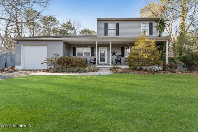 view of property with a garage, a porch, and a front lawn