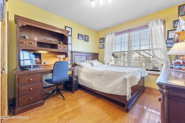 18 Tall Oaks Ct, Old Bridge, NJ 08857 - bedroom with a textured ceiling, light wood-style floors, an office area, and wainscoting