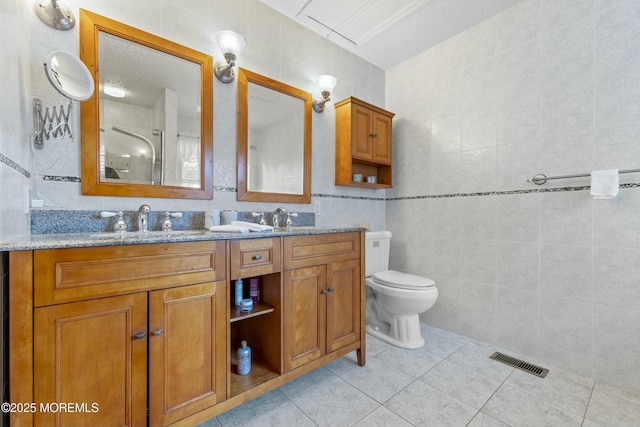 18 Tall Oaks Ct, Old Bridge, NJ 08857 - full bath with tile patterned floors, tile walls, double vanity, and toilet