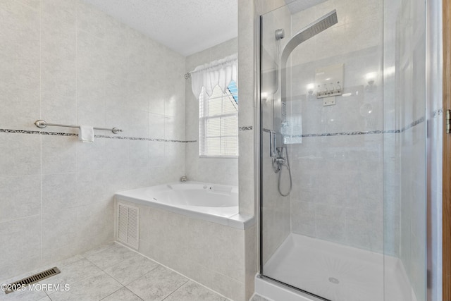 18 Tall Oaks Ct, Old Bridge, NJ 08857 - bathroom featuring tile patterned floors, a shower stall, a garden tub, and tile walls