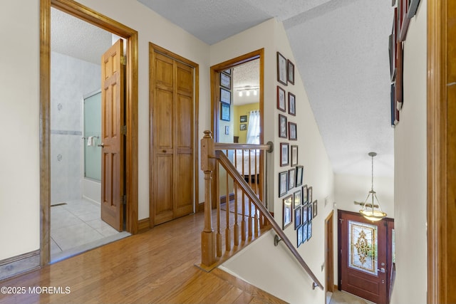18 Tall Oaks Ct, Old Bridge, NJ 08857 - entryway with a textured ceiling and light wood-style floors