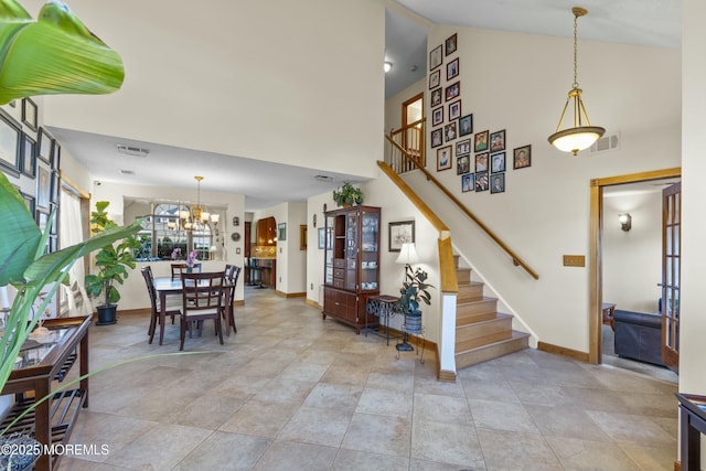 18 Tall Oaks Ct, Old Bridge, NJ 08857 - staircase featuring baseboards, high vaulted ceiling, and a chandelier
