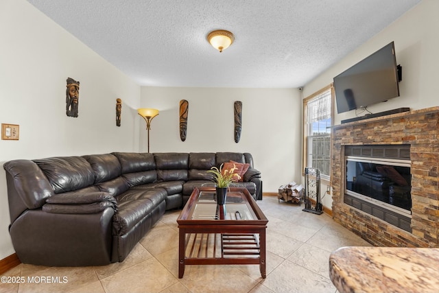 18 Tall Oaks Ct, Old Bridge, NJ 08857 - living room with a glass covered fireplace, a textured ceiling, light tile patterned floors, and baseboards