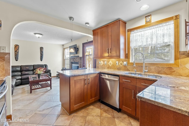 18 Tall Oaks Ct, Old Bridge, NJ 08857 - kitchen with a sink, appliances with stainless steel finishes, brown cabinetry, and light stone counters
