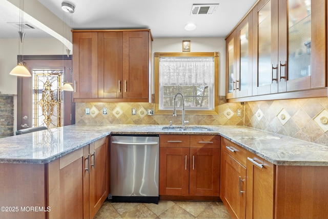 18 Tall Oaks Ct, Old Bridge, NJ 08857 - kitchen featuring stainless steel dishwasher, a sink, light stone countertops, a peninsula, and plenty of natural light