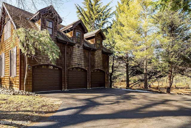 view of gate with a garage