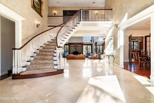 entryway with a towering ceiling