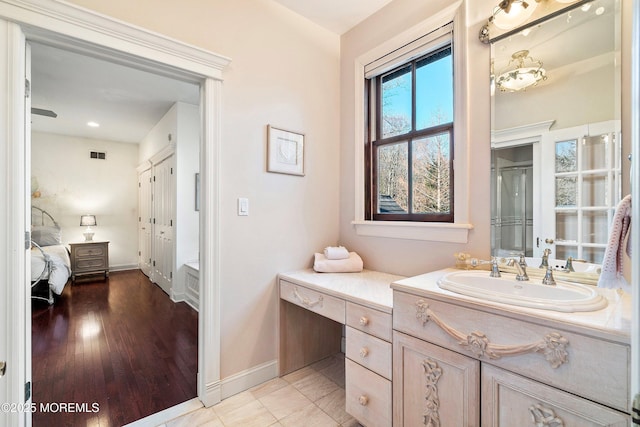 bathroom with vanity and wood-type flooring