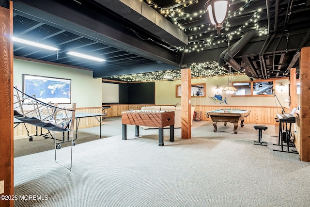 recreation room featuring carpet flooring, pool table, and wood walls