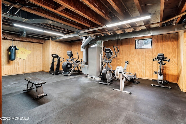 workout room with wood walls