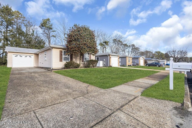 single story home featuring a garage and a front yard