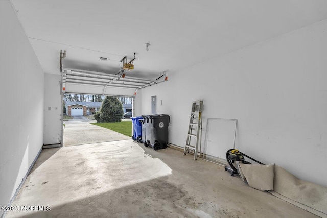 garage featuring a garage door opener and electric panel