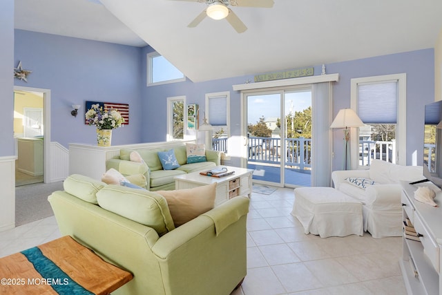 tiled living room with ceiling fan