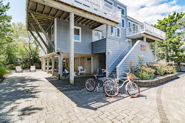 rear view of property featuring a patio area