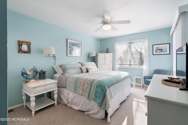 bedroom featuring light carpet and ceiling fan