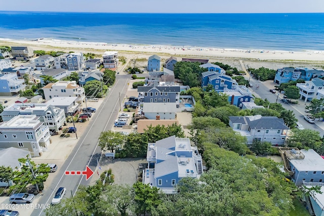 bird's eye view with a beach view and a water view