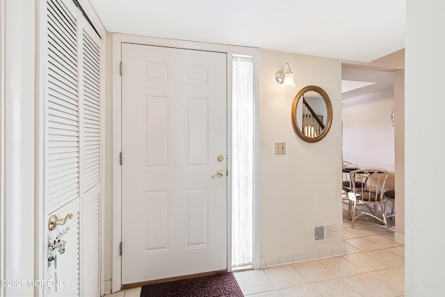 entryway featuring light tile patterned floors